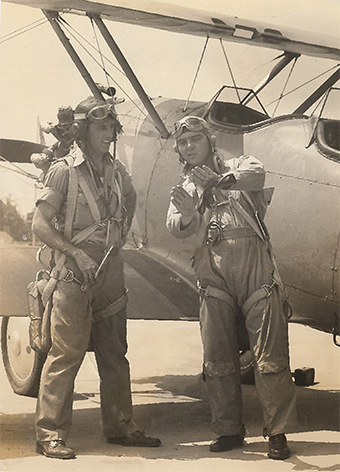 Aged photo of Sidney Miller in front of propeller plane